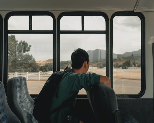 A person looking relaxed while commuting on a bus